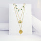 Collier bohème à triple rangées avec médaillon, soleil et perles émeraudes en acier inoxydable BOHEMIA